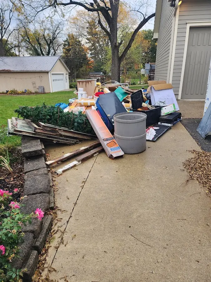 Dumpster being loaded with debris for 30 Yard Dumpster Rental in Herriman